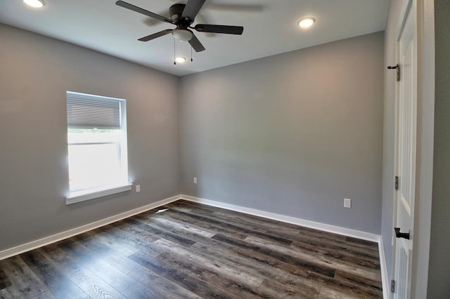 spare room with dark wood-style flooring, a ceiling fan, baseboards, and recessed lighting