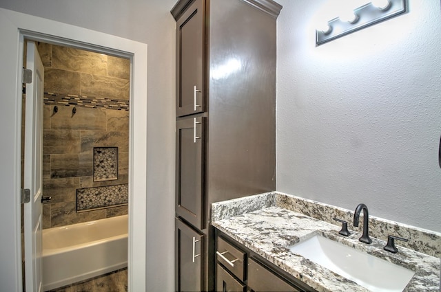 bathroom with vanity and tub / shower combination