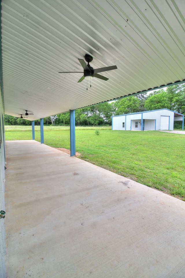 view of patio featuring an outdoor structure and ceiling fan