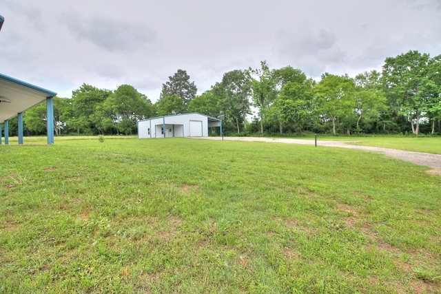 view of yard with an outdoor structure and a garage