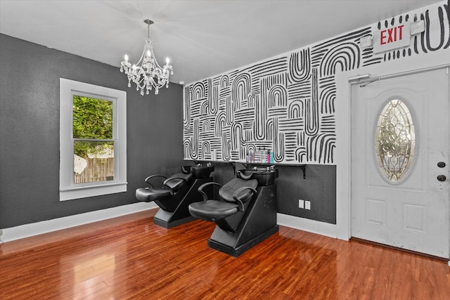 interior space with a chandelier and hardwood / wood-style flooring