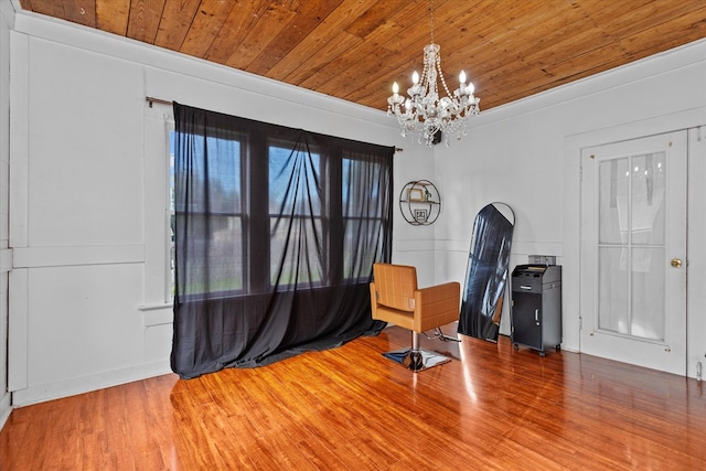 office area with wood-type flooring, an inviting chandelier, and wooden ceiling