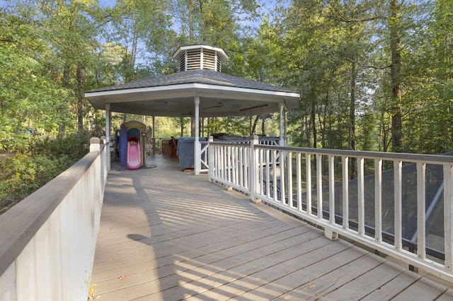 wooden deck featuring a gazebo and ceiling fan