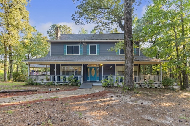 country-style home with covered porch