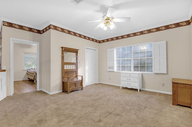 unfurnished bedroom with light carpet, a closet, ceiling fan, and ornamental molding