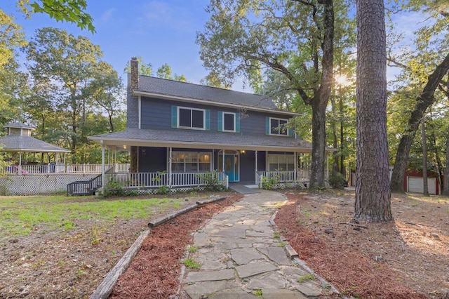 country-style home featuring covered porch