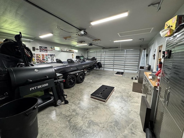 3640 Wingate Blvd, Brookeland, TX 75931 - garage featuring a garage door opener