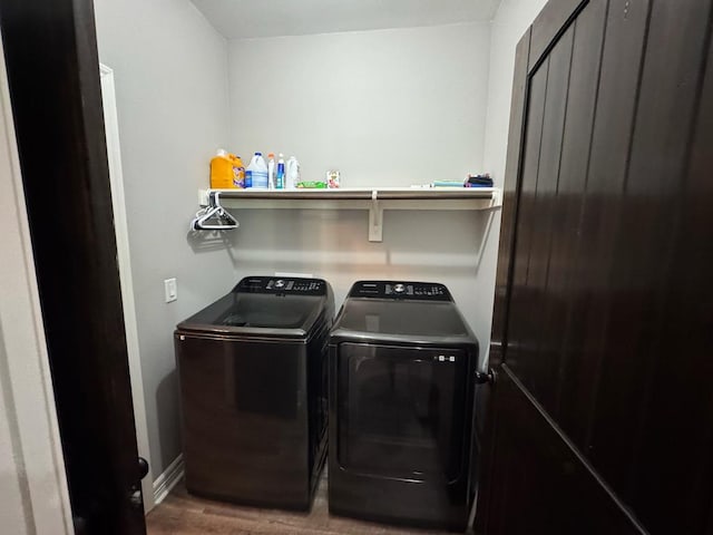 3640 Wingate Blvd, Brookeland, TX 75931 - laundry room featuring separate washer and dryer and wood finished floors