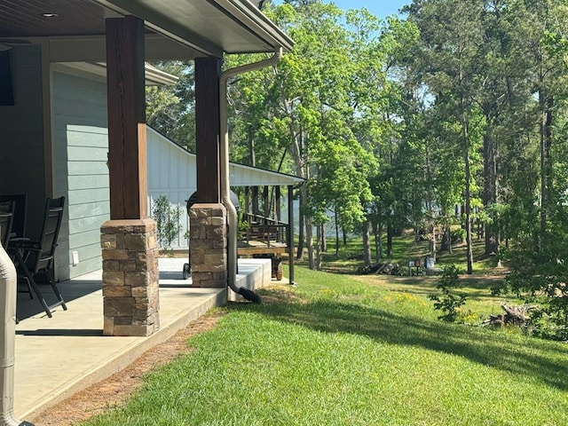 3640 Wingate Blvd, Brookeland, TX 75931 - view of grassy yard featuring a porch