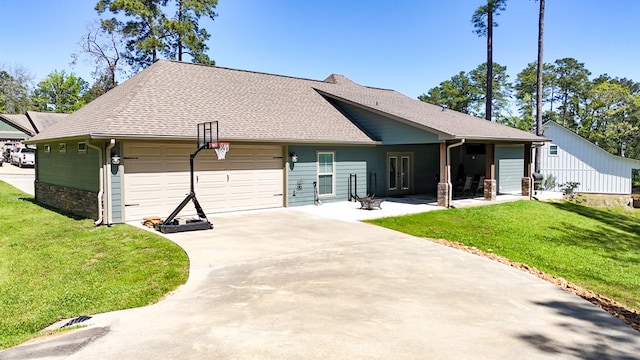 3640 Wingate Blvd, Brookeland, TX 75931 - back of property featuring an attached garage, a lawn, concrete driveway, and a shingled roof