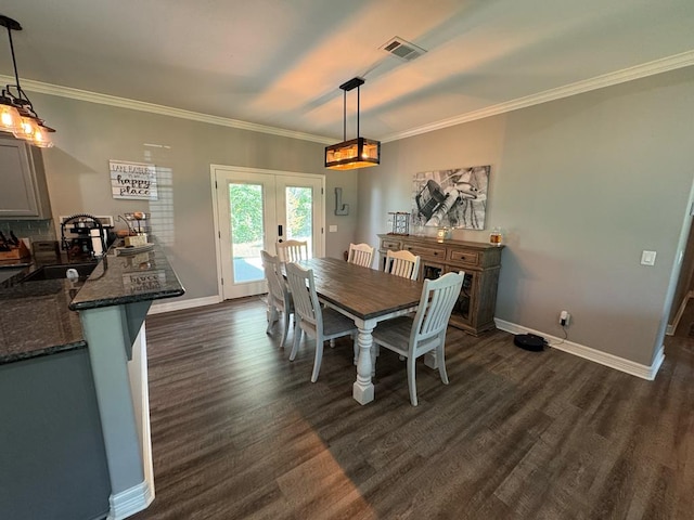 3640 Wingate Blvd, Brookeland, TX 75931 - dining space with dark wood-style floors, ornamental molding, and french doors