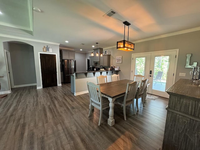 3640 Wingate Blvd, Brookeland, TX 75931 - dining area featuring arched walkways, dark wood-type flooring, french doors, ornamental molding, and recessed lighting