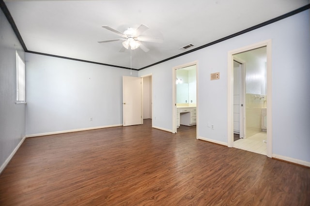 1308 Brook Holw, Lufkin, TX 75904 - unfurnished bedroom featuring ensuite bathroom, wood finished floors, and crown molding