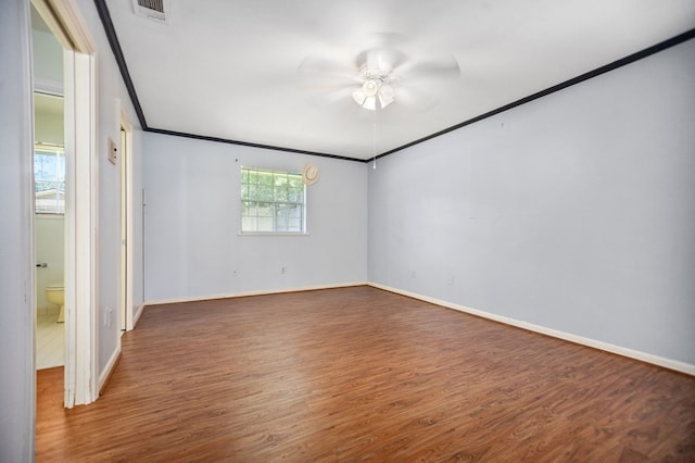 1308 Brook Holw, Lufkin, TX 75904 - empty room featuring wood finished floors, ceiling fan, and crown molding