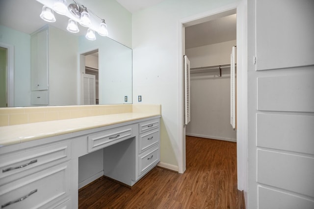 1308 Brook Holw, Lufkin, TX 75904 - bathroom featuring wood finished floors, vanity, and a closet
