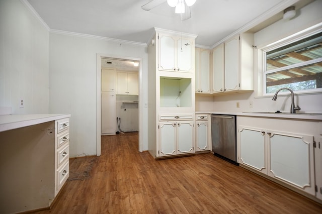 1308 Brook Holw, Lufkin, TX 75904 - kitchen featuring stainless steel dishwasher, crown molding, ceiling fan, wood finished floors, and light countertops