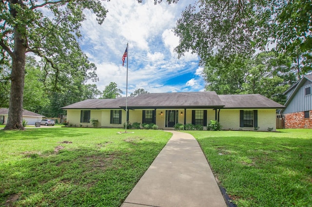 1308 Brook Holw, Lufkin, TX 75904 - ranch-style home featuring brick siding and a front lawn