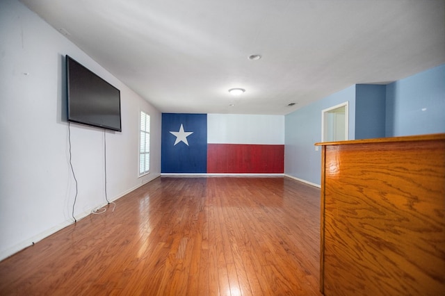 1308 Brook Holw, Lufkin, TX 75904 - spare room featuring hardwood / wood-style flooring and baseboards