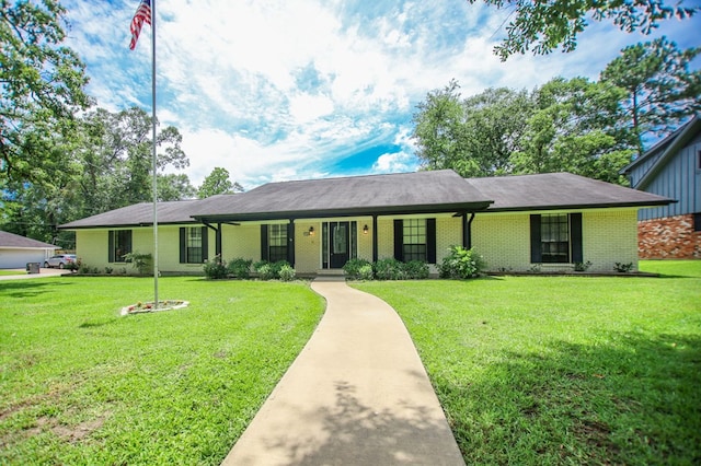 1308 Brook Holw, Lufkin, TX 75904 - ranch-style house featuring a front yard, brick siding, and covered porch