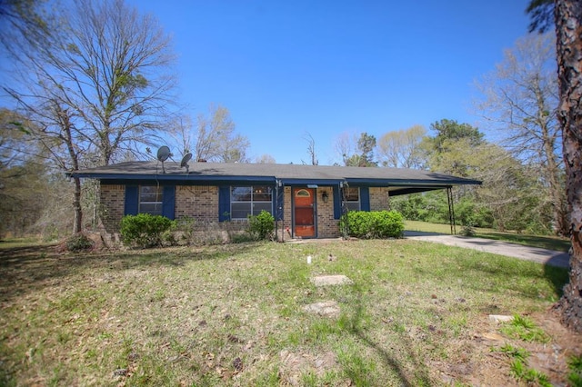 ranch-style home with brick siding, concrete driveway, a front yard, and a carport