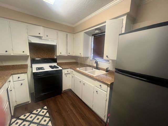 kitchen featuring black range with gas cooktop, dark wood-style flooring, freestanding refrigerator, under cabinet range hood, and a sink