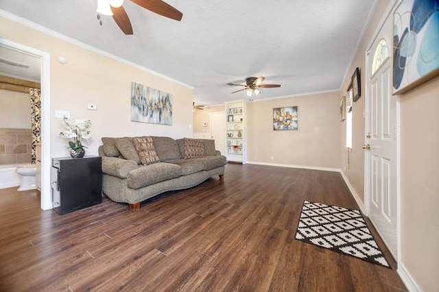 living area featuring dark wood-style floors, a ceiling fan, and ornamental molding