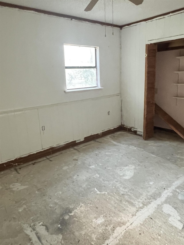 interior space featuring ceiling fan