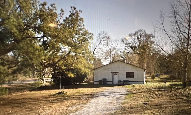 view of home's exterior featuring an outbuilding