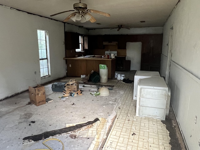 kitchen featuring ceiling fan and ventilation hood