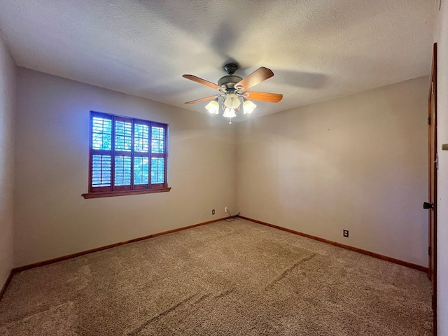 spare room with a textured ceiling, ceiling fan, and carpet flooring