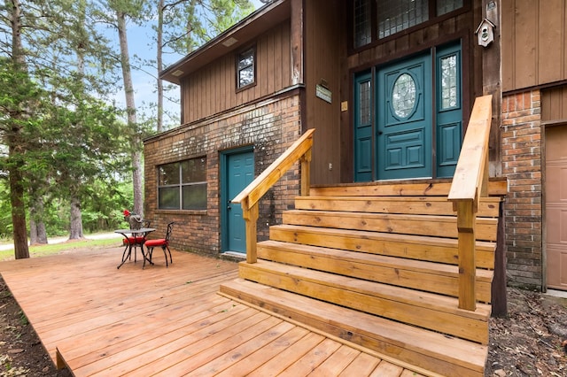 doorway to property featuring a wooden deck