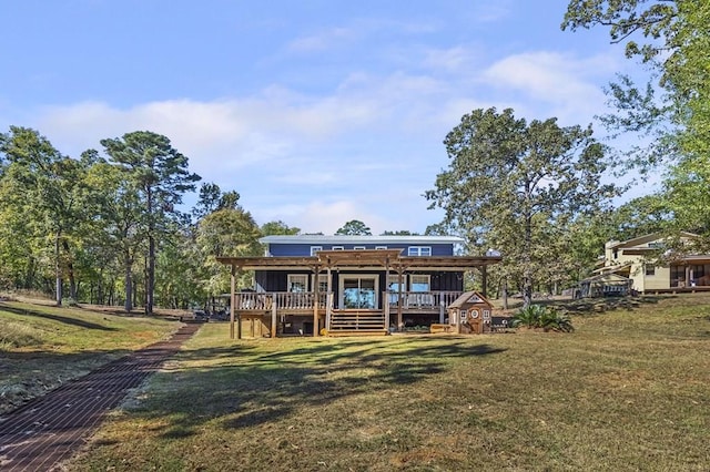 back of property featuring a yard