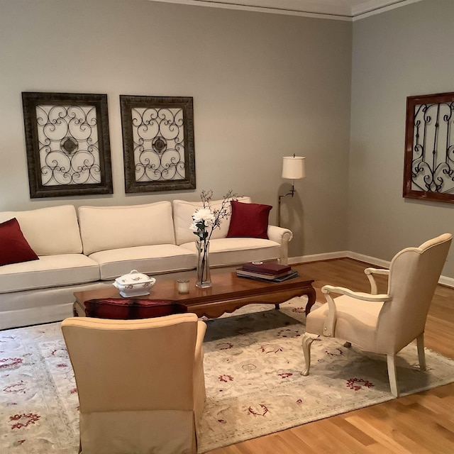 living room with crown molding and hardwood / wood-style flooring