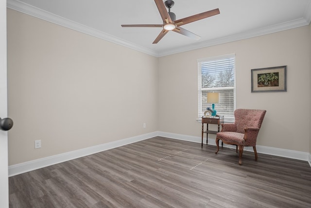 living area featuring ceiling fan, ornamental molding, dark wood-type flooring, and baseboards