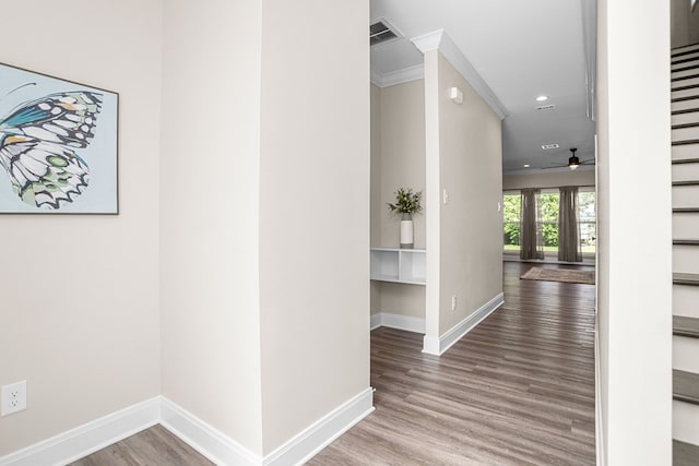 corridor featuring recessed lighting, visible vents, baseboards, and wood finished floors