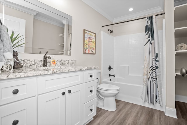 bathroom featuring toilet, ornamental molding, shower / tub combo, vanity, and wood finished floors