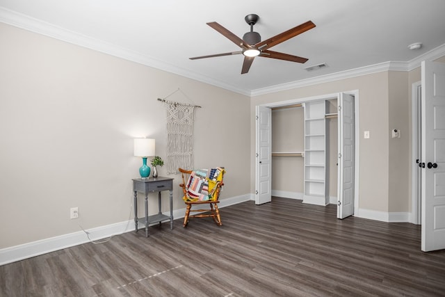 living area with dark wood-style floors, baseboards, and ornamental molding