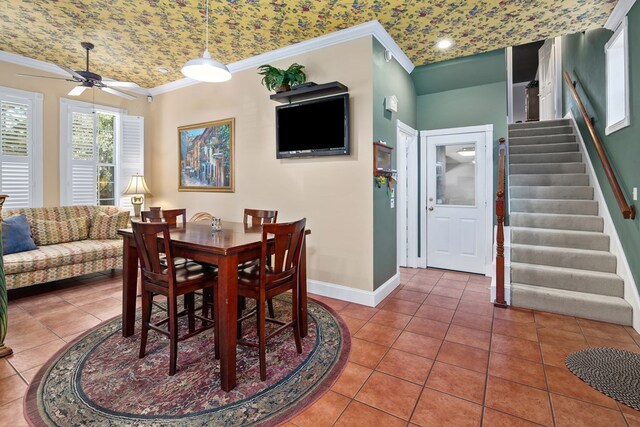 dining area featuring ceiling fan, brick ceiling, tile patterned floors, and crown molding