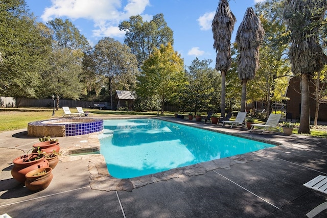 view of pool with an in ground hot tub and a patio area