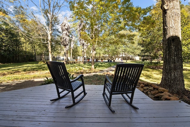 deck featuring a lawn