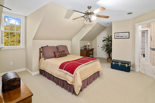 carpeted bedroom with ceiling fan and lofted ceiling