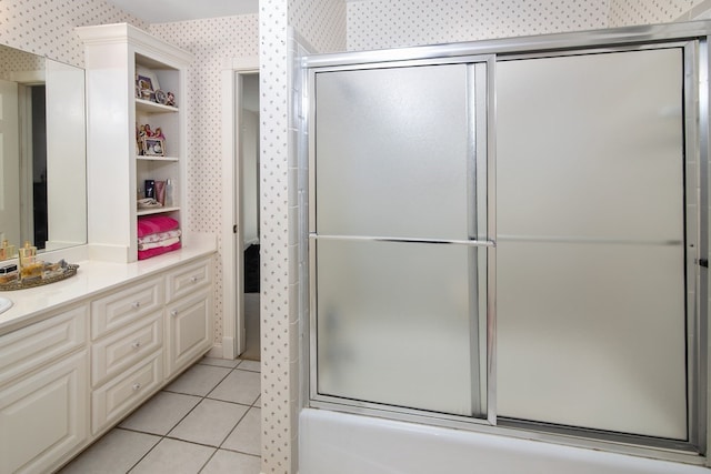 full bath with wallpapered walls, tile patterned flooring, an enclosed shower, and vanity