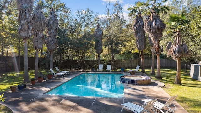 view of swimming pool with an in ground hot tub, a yard, and a patio