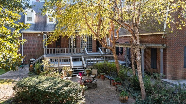 view of patio with a fire pit