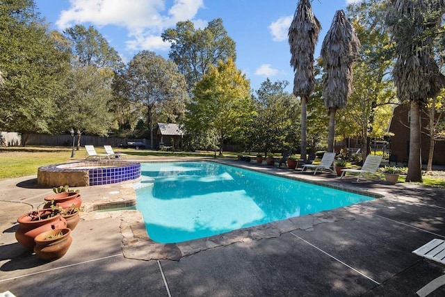 1409 Bending Brook Cir, Lufkin, TX 75904 - view of pool with a patio area, an in-ground hot tub, fence, and view of scattered trees