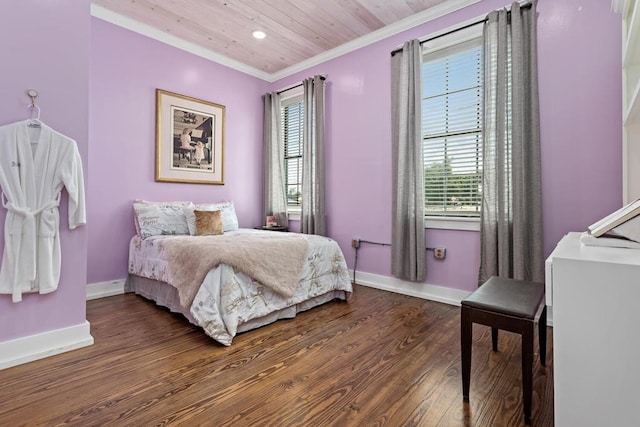 bedroom featuring baseboards, ornamental molding, and multiple windows