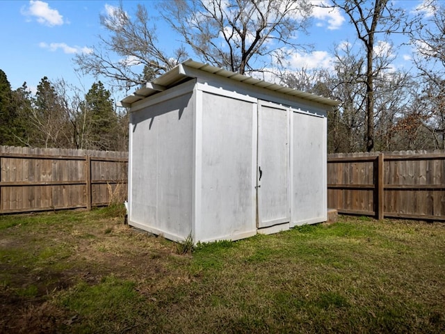 view of shed featuring a fenced backyard