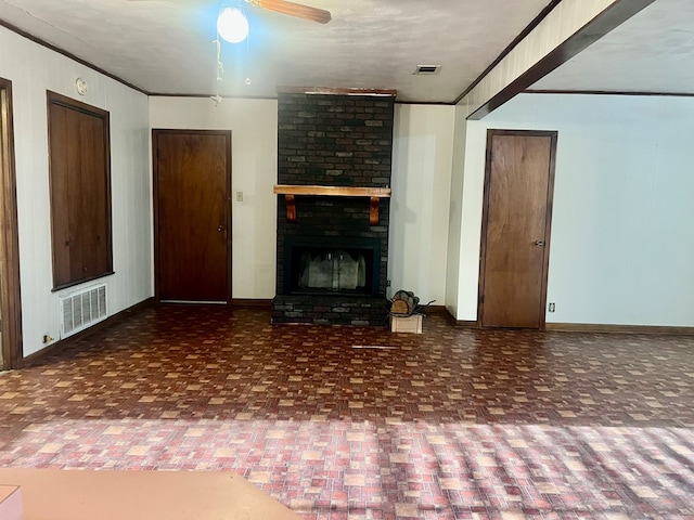 602 Devereaux, Diboll, TX 75941 - unfurnished living room featuring baseboards, a fireplace, a ceiling fan, and ornamental molding