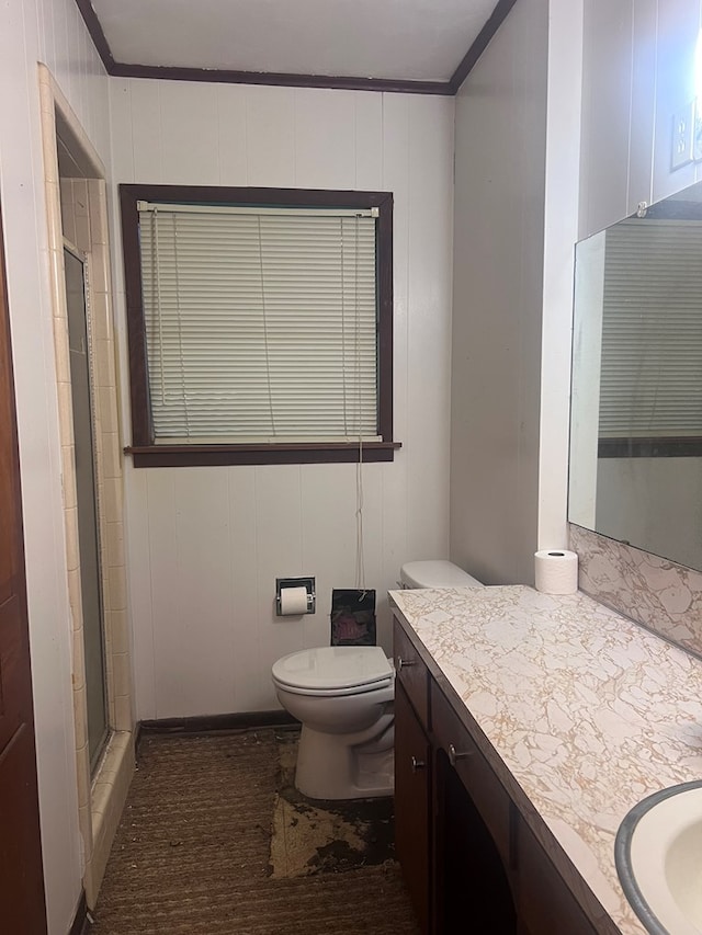 602 Devereaux, Diboll, TX 75941 - full bath with vanity, ornamental molding, toilet, and a shower with shower door