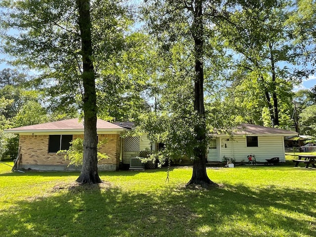 602 Devereaux, Diboll, TX 75941 - view of front of home with a front lawn and brick siding